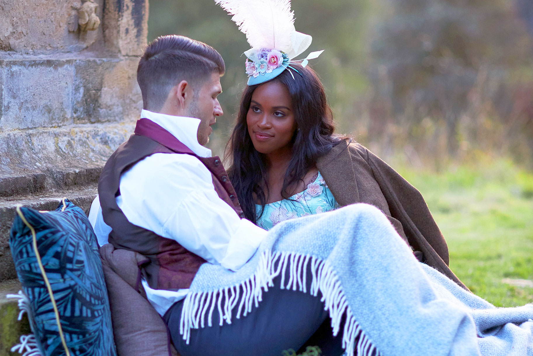 Nicole Remy sitting on grass with a suitor