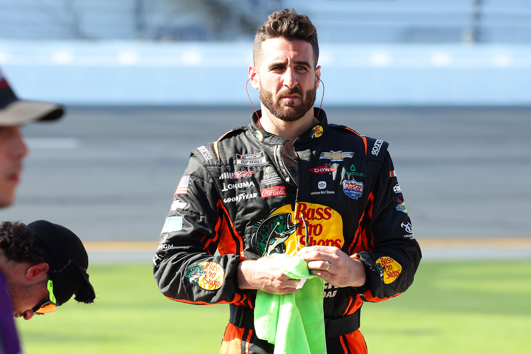 Paul Swan holding a green rag at a Nascar event