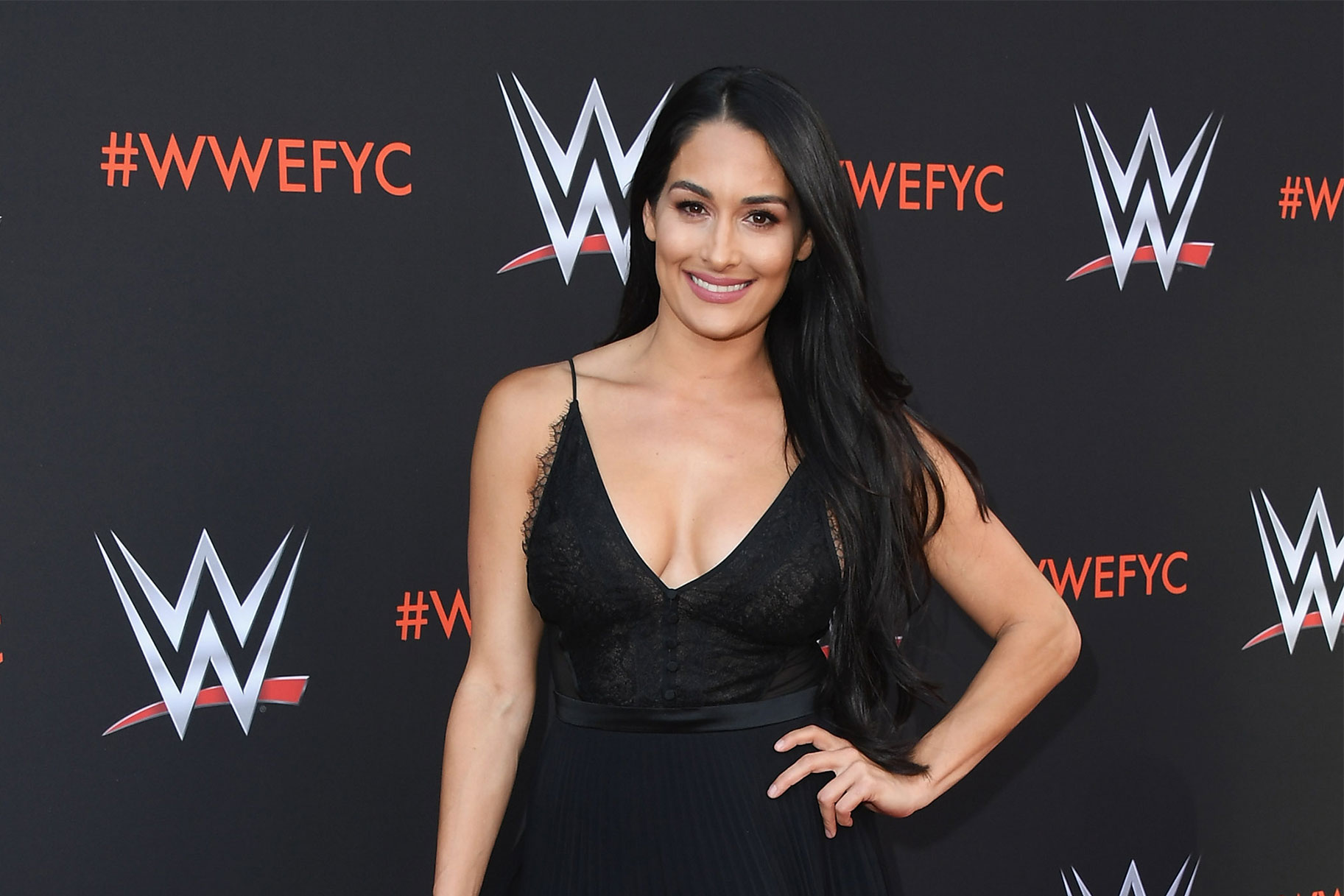 Nikki Bella walking a red carpet