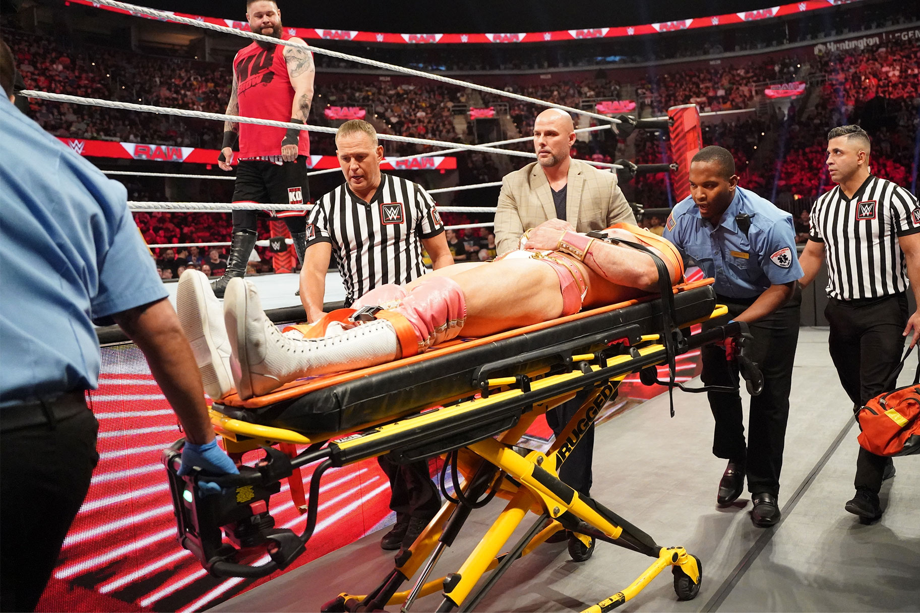 Ezekiel being wheeled away on a stretcher