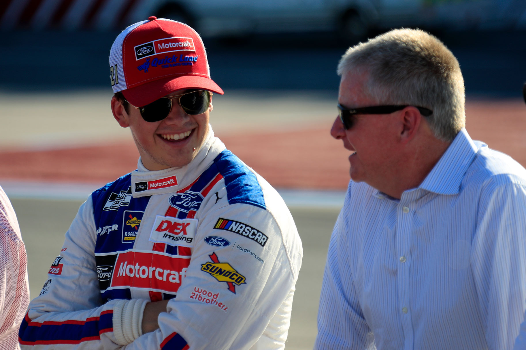 Harrison Burton smiling with his dad Jeff Burton