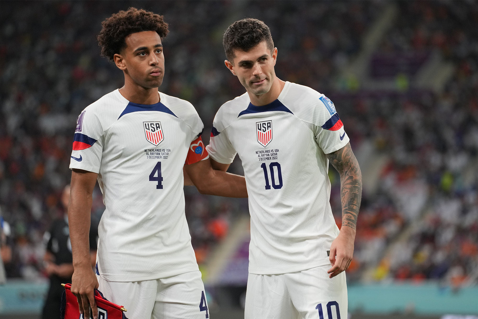 Tyler Adams #4 and Christian Pulisic #10 of the United States during a FIFA World Cup Qatar 2022 Round of 16 match