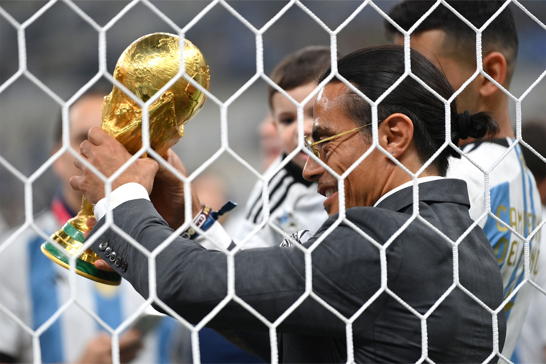 Nusret Goekce, nicknamed Salt Bae, admires the FIFA World Cup Qatar 2022 Winner's Trophy after the FIFA World Cup Qatar 2022 Final match