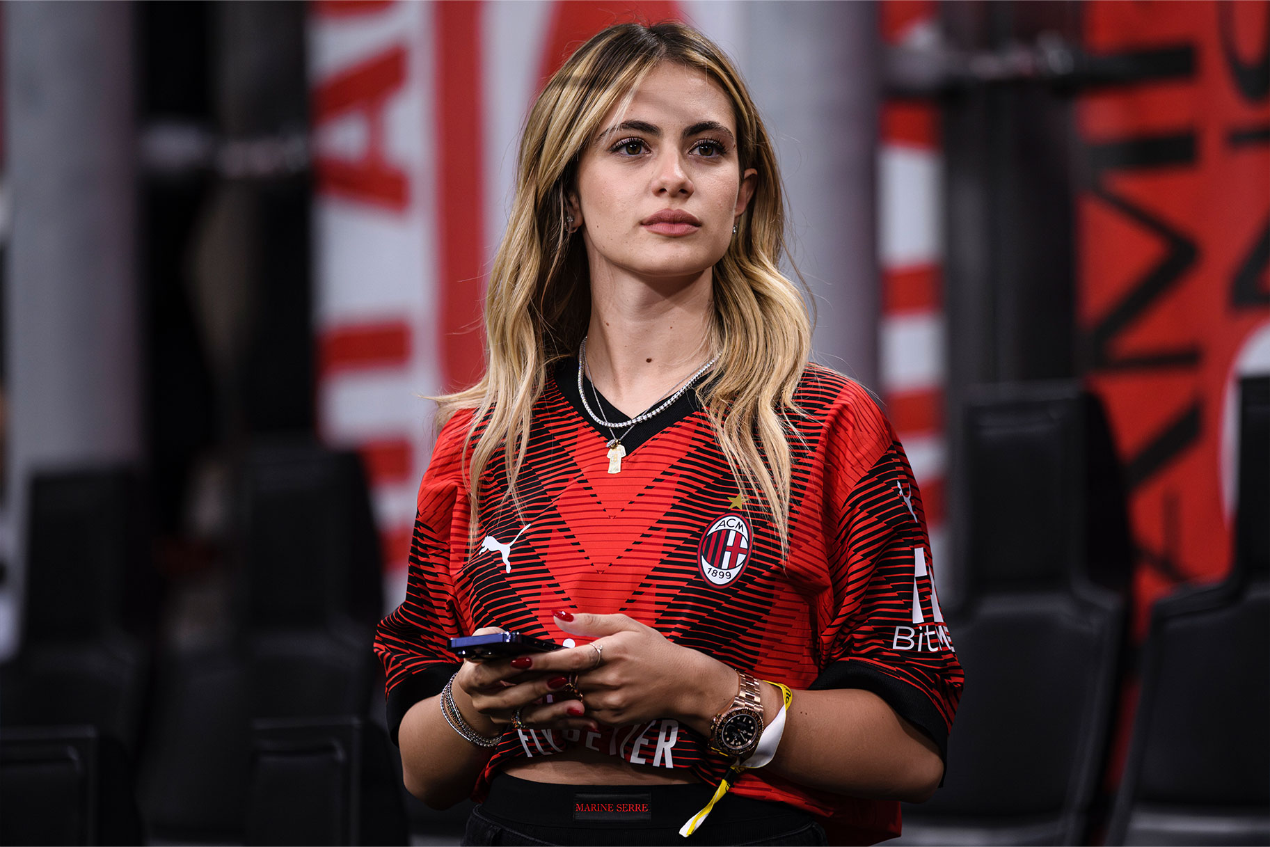 Giulia watches Sandro Tonali during a match