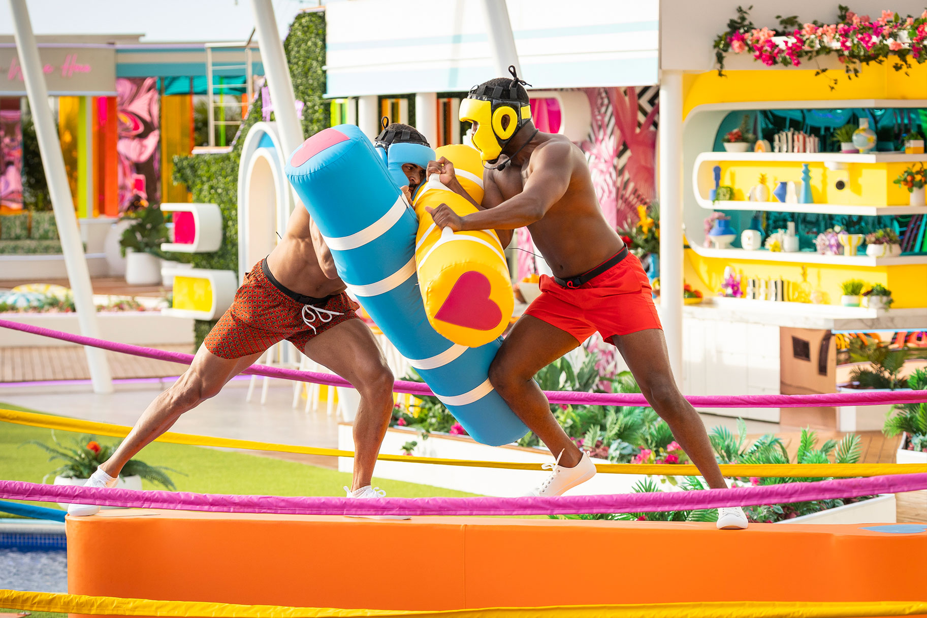 Johnny Middlebrooks II and Ray Gant wrestle during a game