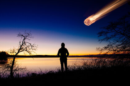 Woman watching a meteor in the sky