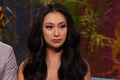 Close up of Iris at the reunion looking a little sad