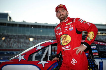 Austin Dillon posed in front of his racecar