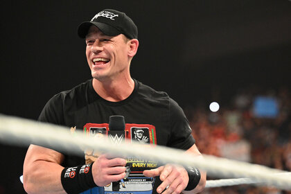 Close up of John Cena smiling in the ring