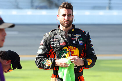 Paul Swan holding a green rag at a Nascar event