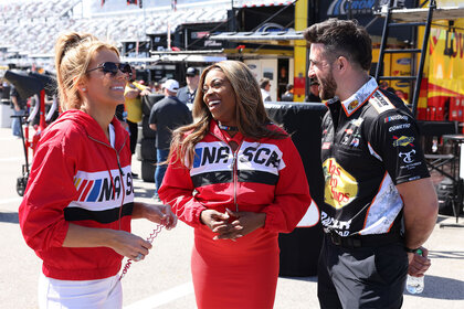 Whitney, Mariel, and Paul talking and laughing with each other