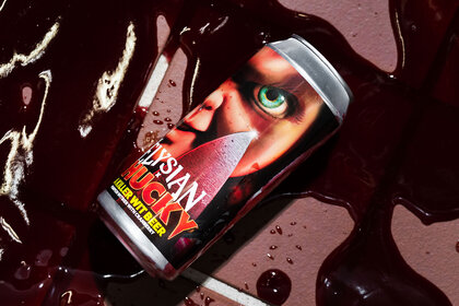 A can of Chucky beer in a puddle of blood