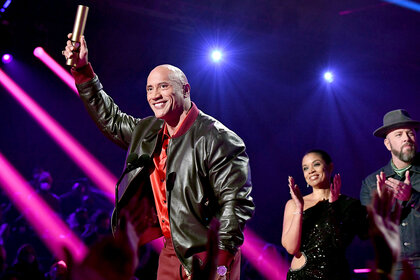 Dwayne Johnson onstage winning a Peoples Choice Award