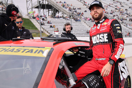 Ross Chastain enters his car during qualifying for the NASCAR Cup Series Xfinity 500