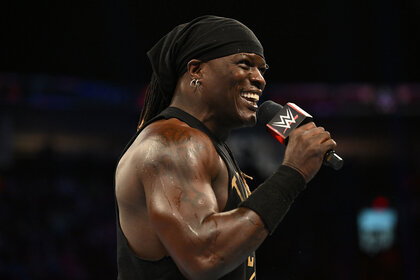 R Truth speaking to the crowd