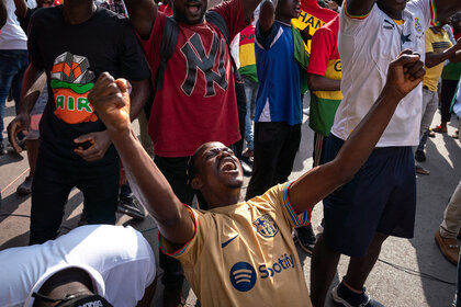 Fans celebrate at a watch party at the Ghana Broadcasting Corporation (GBC) in Accra as Ghana scores against South Korea during the FIFA World Cup Qatar 2022