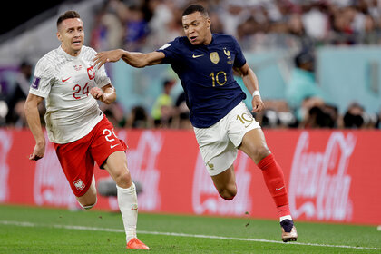 L-R) Przemyslaw Frankowski of Poland, Kylian Mbappe of France during the World Cup match between France v Poland