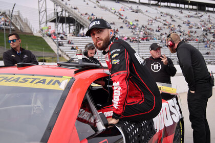 Ross Chastain entering his racing car