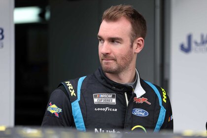 Cody Ware, driver of the #51 Nurtec ODT Ford, walks the garage area during practice for the NASCAR Cup Series 64th Annual Daytona 500 at Daytona International Speedway