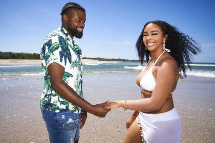 Alexis Nicole And Devon Wright hold hands on the beach on The Big D