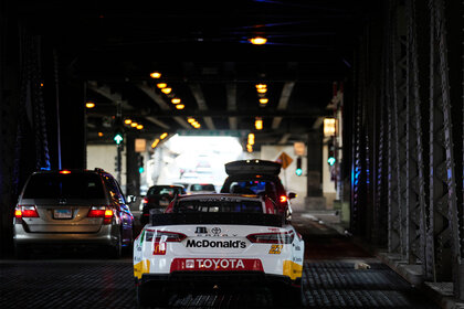 Bubba Wallace drives on Lower Lake Shore Drive in promotion of the NASCAR Chicago Street Race announcement on July 19, 2022