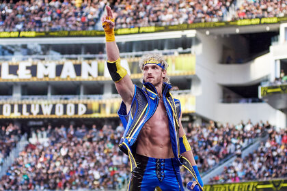 Logan Paul stands on the top rope of the ring at Wrestlemania