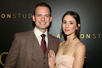 Patrick J. Adams and Troian Bellisario smile on the red carpet of the Amazon Studios Golden Globes After Party