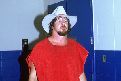 Wrestler Terry Funk looks on in the hallway.