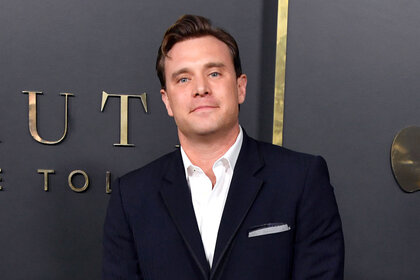 Billy Miller posing on a red carpet