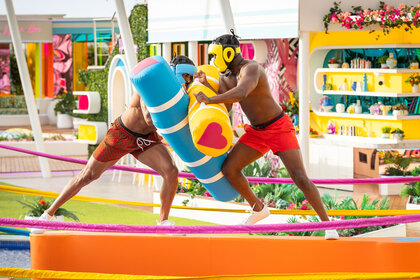 Johnny Middlebrooks II and Ray Gant wrestle during a game