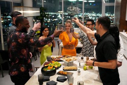 yan Babel, Lloyd Jones, Sophia, Jacklyn, Marco Fabián, and Sebastián Fassi share a toast in Love Undercover Season 1 Episode 1.