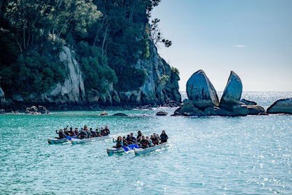 Race to Survive: New Zealand contestants row boats in Season 2, Episode 1.