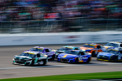 Brad Keselowski, Denny Hamlin, Erik Jones, Tyler Reddick, Ryan Blaney, Kevin Harvick, and Chase Elliott race during the NASCAR Cup Series Hollywood Casino 400