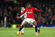 Marcus Rashford is challenged by Pedro Porro during the Premier League match between Manchester United and Tottenham Hotspur