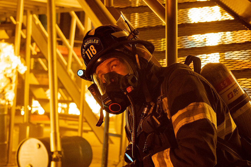 911's Oliver Stark in a burning building