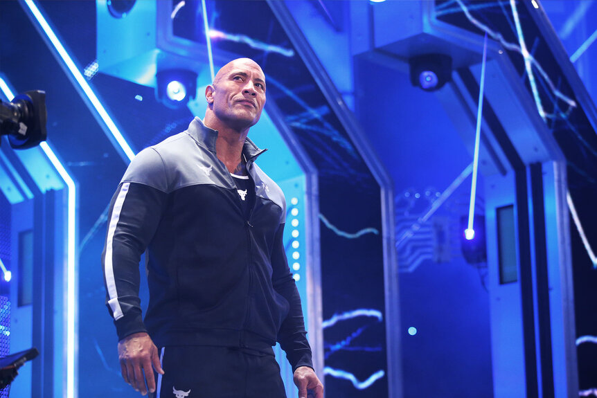 The Rock walking to the ring