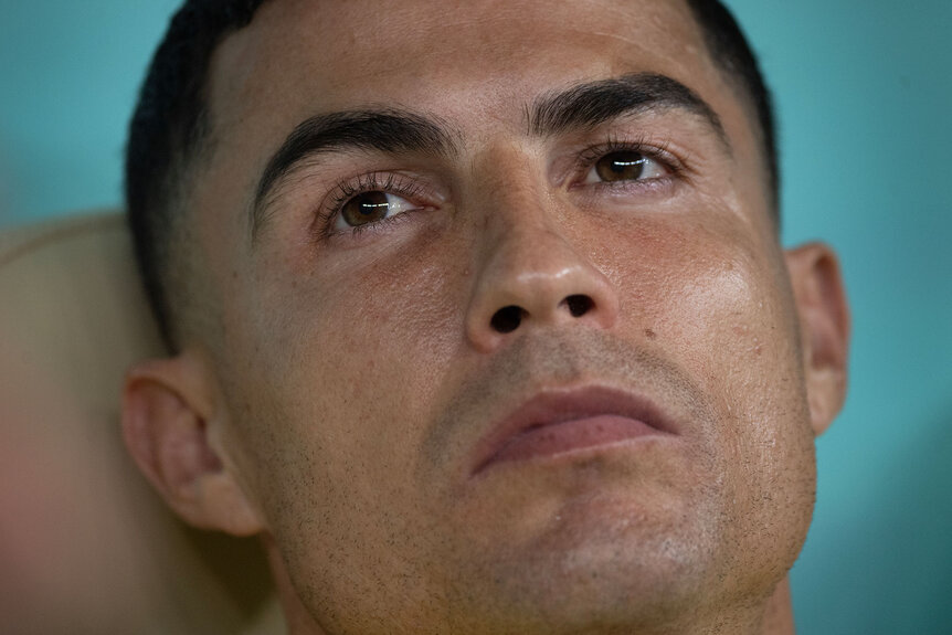 Cristiano Ronaldo of Portugal sits on the bench before the FIFA World Cup Qatar 2022 Round of 16 match between Portugal and Switzerland