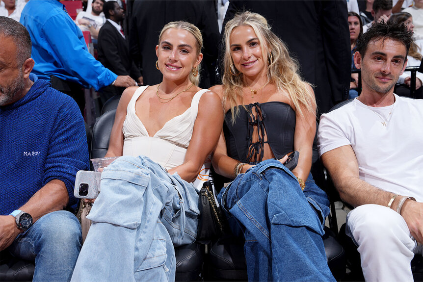 Haley Cavinder and Hanna Cavinder sit court side at the NBA Finals