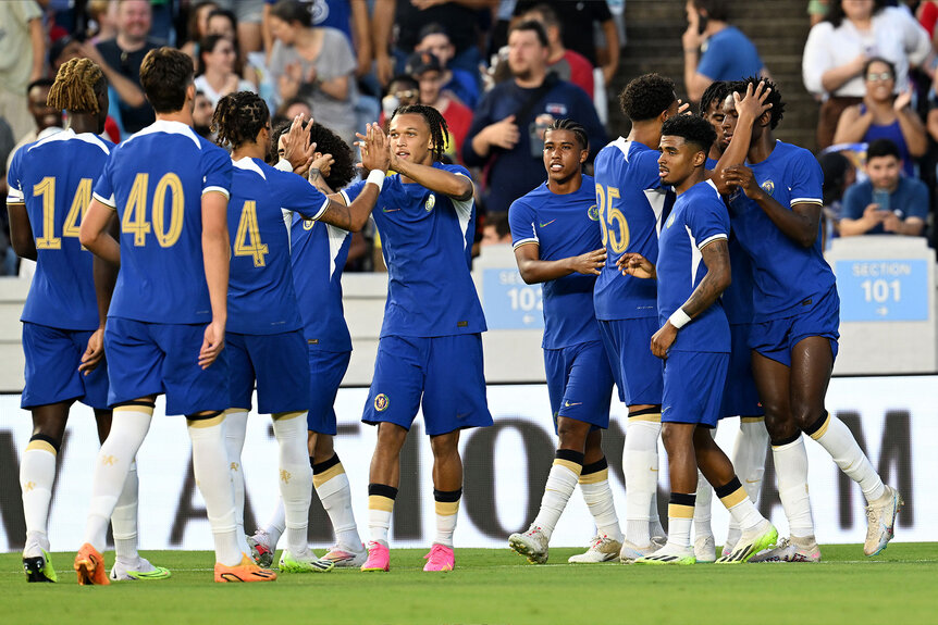 The Chelsea team huddles together during a pre season friendly match