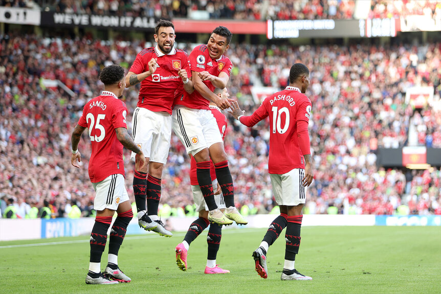 Bruno Fernandes of Manchester United jumps in celebration with teammate Casemiro