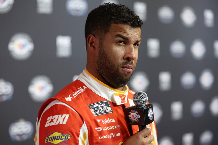 Bubba Wallace makes a face while at a nascar press event