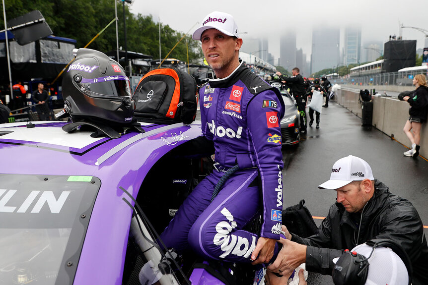 Denny Hamlin climbs into his racecar