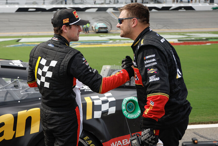 Ryan Blaney receives a congratulatory handshake after a race