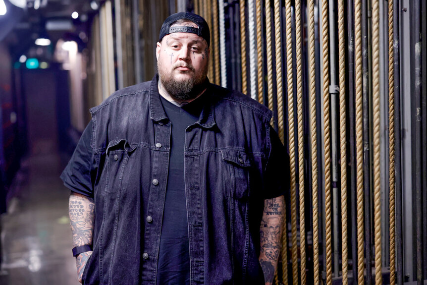 Jelly Roll wearing a black button up shirt and black tee at his 9/11 tribute at iHeartRadio