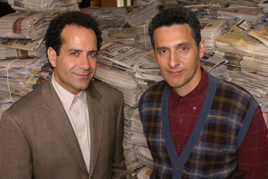 John Turturro and Tony Shalhoub standing together