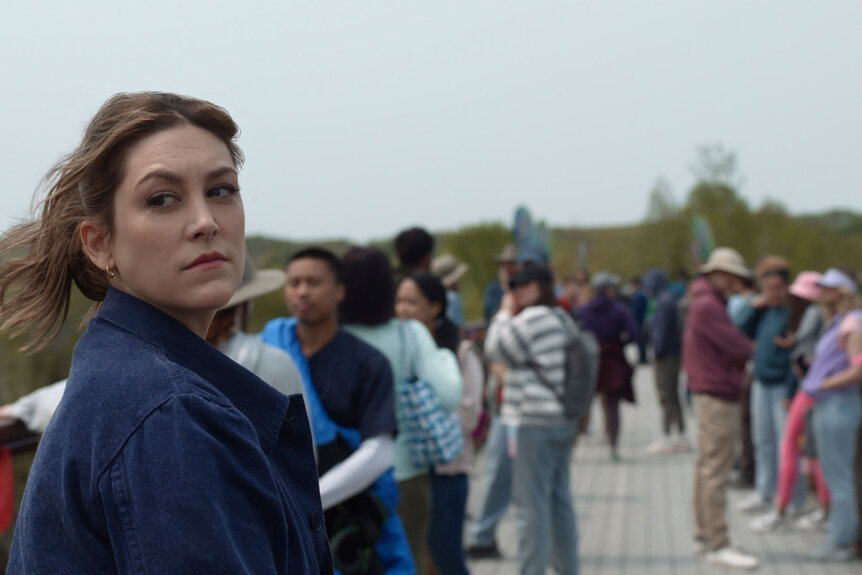 Molly (Caitlin McGee) looks over her shoulder