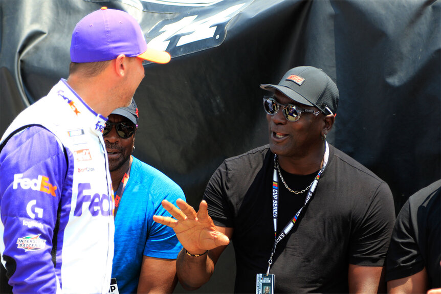 Nascar Denny Hamlin Michael Jordan OutfitMichael Jordan talks with Denny Hamlin during a qualifying race