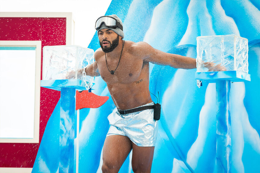 Johnny Middlebrooks stands with his hands in ice blocks during a game