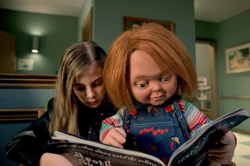 Caroline Cross (Carina Battrick) and Chucky read a book together in Chucky 303.