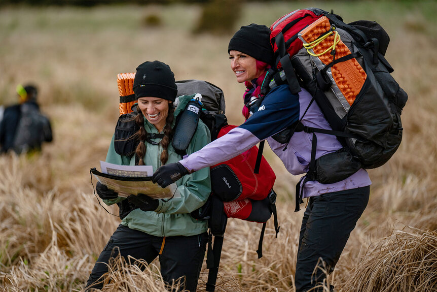 Rhandi Ohrme and Ashley Paulson look at a map together